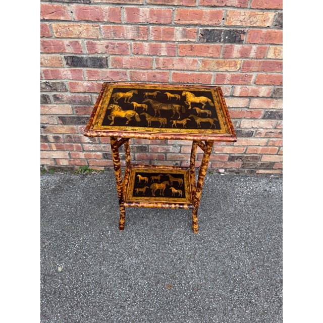 This is a beautifully decoupage English bamboo side table octagon in shape. The yellow against the black background in...