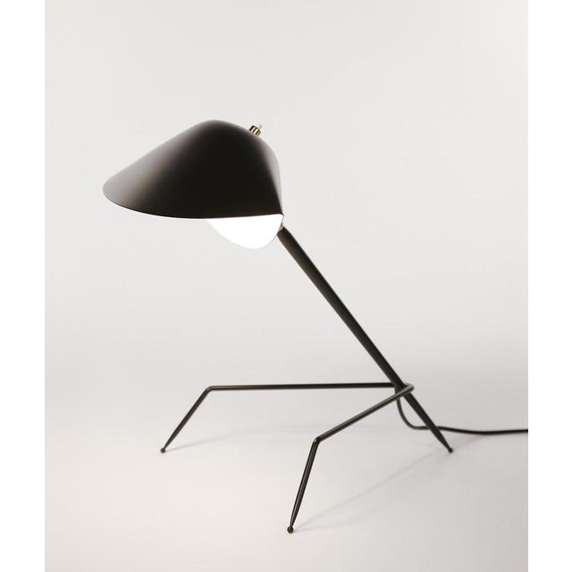 Table lamp model 'tripod lamp' designed by serge mouille in 1954. manufactured by editions serge mouille in france. The...