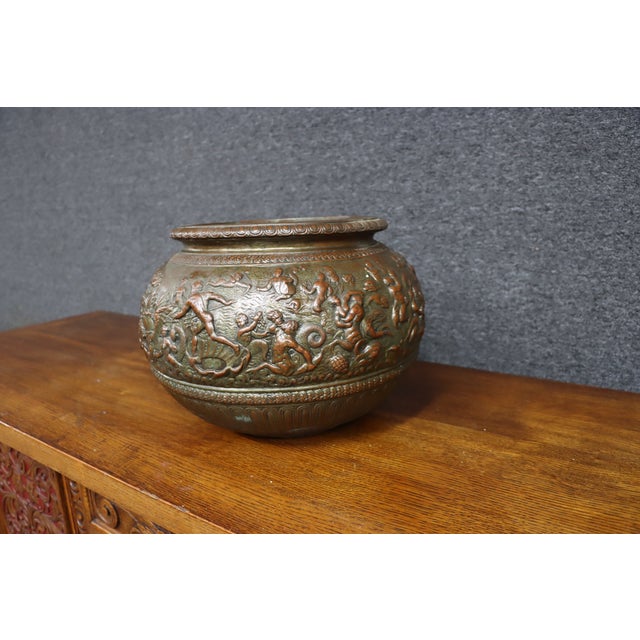 Italian terracotta art pottery jardinière by Dini & Cellai, decorated with an elaborate continuous relief of classical...