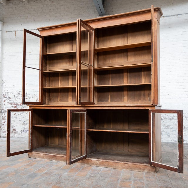 Antique cherry wood display cabinet dating from the early 19th century. Crafted from solid cherry wood, this antique...