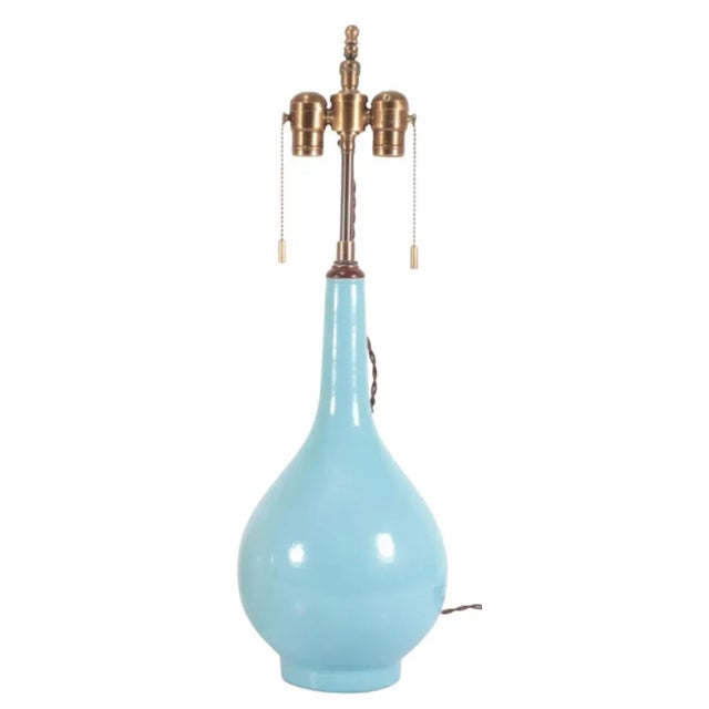 A vintage sky blue porcelain gourd lamp with a slender neck and round bottom in a beautiful shade of robin's egg blue. Two...