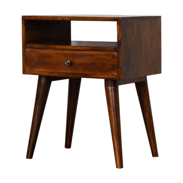 Built from solid mango wood in a rich chestnut tone, this versatile table suits any corner of your home. A single drawer...
