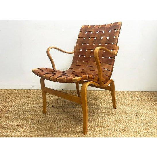 A 1960's design, the "Eva" chair was designed by Bruno Mathsson. The lounge chair exemplifies Swedish functionalism. The...