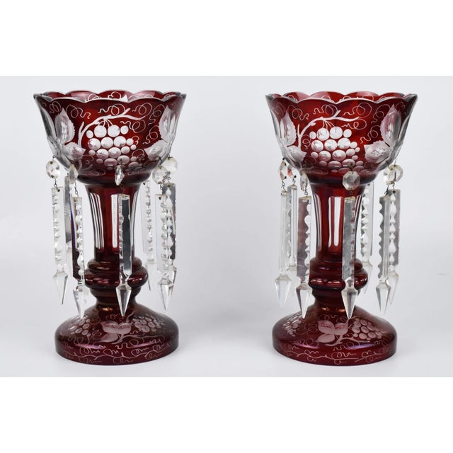 A beautiful antique pair of Bohemian ruby glass mantle lusters with wheel cut and engraved grapevine designs. Age - 19th...