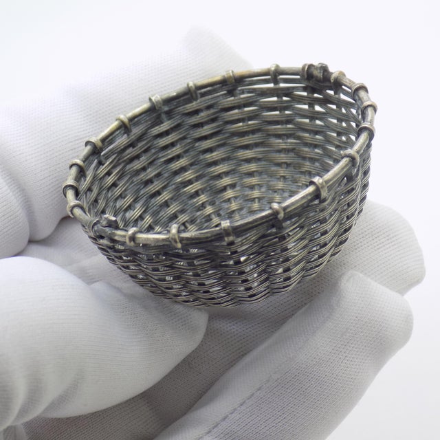 A delightful expression of italian silver miniature craft, this vintage basket figurine features an intricate woven...