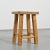 Wooden stool, La Pierra Menta, 1979 A stool with four quadrangular legs, connected by offset cylindrical struts that...