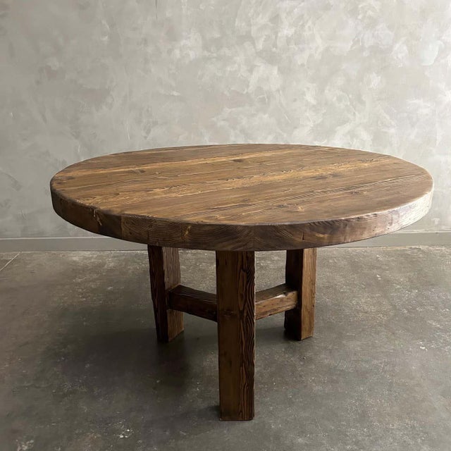 BH COLLECTION Lexi Dining Table Size 42” rd. X 30”h Finish: Dark Walnut with Wax Finish These old elm timbers show in its...