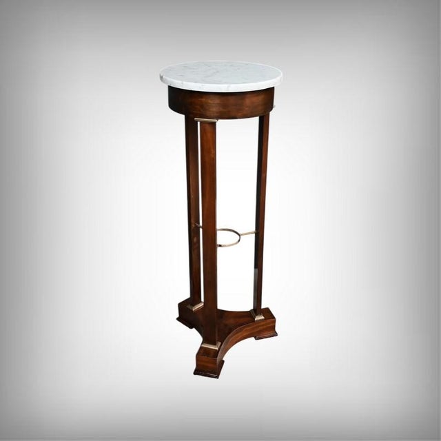 This beautiful Directoire-style side table in mahogany and mahogany veneer is distinguished by its slender and refined...