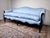 This vintage Louis XV Rococo style sofa features classic French curves and an elegant, serpentine profile that immediately...