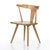 This new take on the mid-century Windsor chair has a bowed, sculptural silhouette. A sandy finish adds movement to wood by...