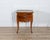 A refined late 19th-century cabinet or bedside table crafted in rich walnut, featuring a delicate writing desk function....
