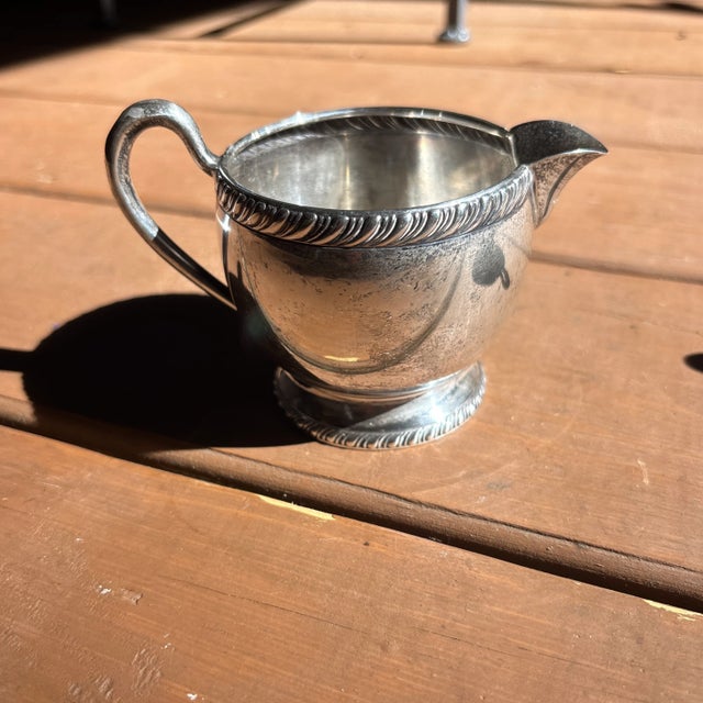 Sterling silver sugar and creamer set, slightly dented but in good shape