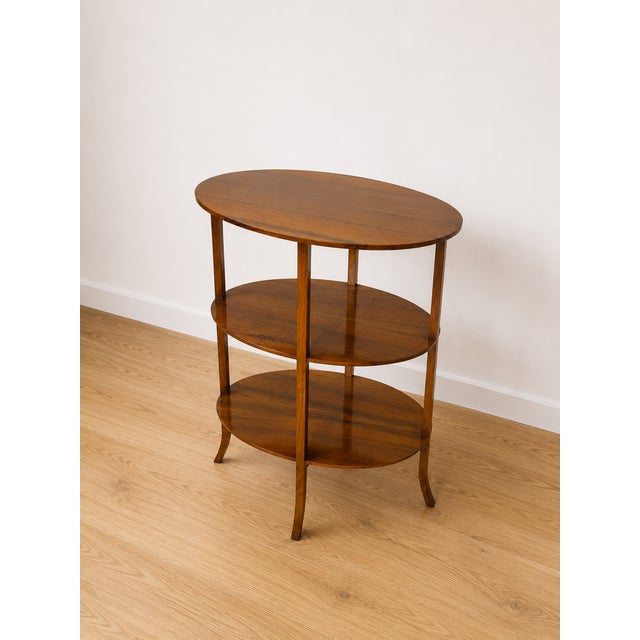 A fine and rare Biedermeier étagère made of walnut, circa 1830. The piece has been restored and is ready for use. The...