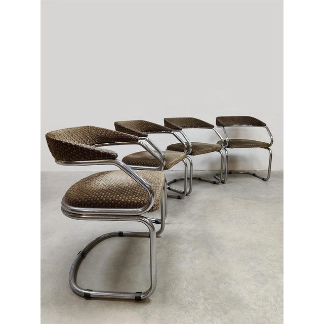 A timeless set of 4 elegant tubular frame chrome dining chairs from the 1970s. The vintage chairs are reminiscent of the...