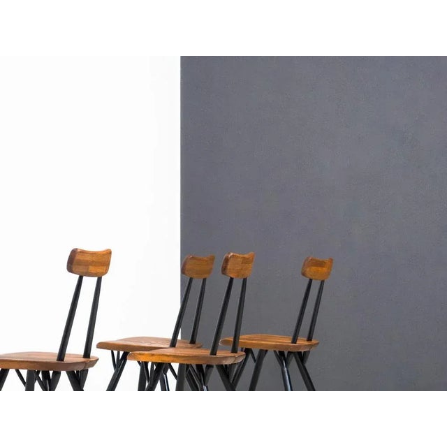 Set of four early Pirkka chairs designed by Ilmari Tapiovaara and manufactured by Laukaan Puu of Finlad in the 1950s....