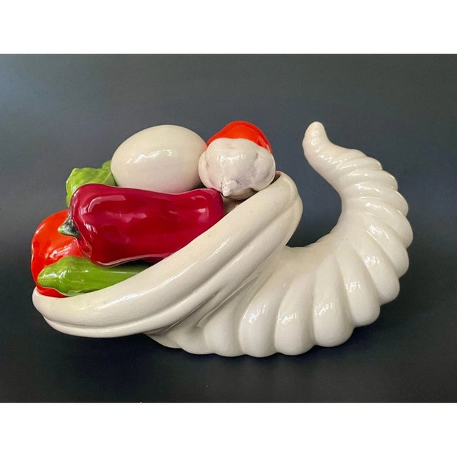 Celebrate the spirit of abundance with this delightful midcentury ceramic cornucopia arrangement. Featuring life-sized...
