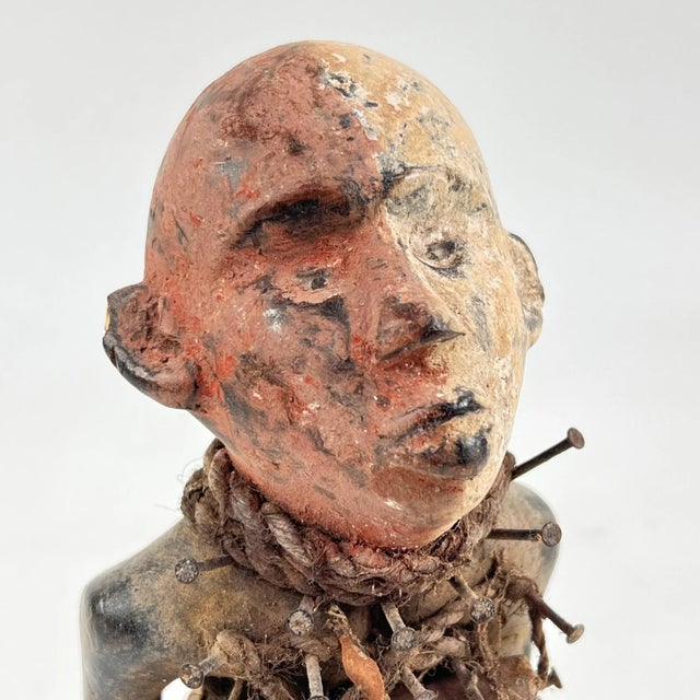 The Kongo Nkisi Nkondi Power Fetish Figure from Congo is a striking, handcrafted spiritual object used in rituals to...