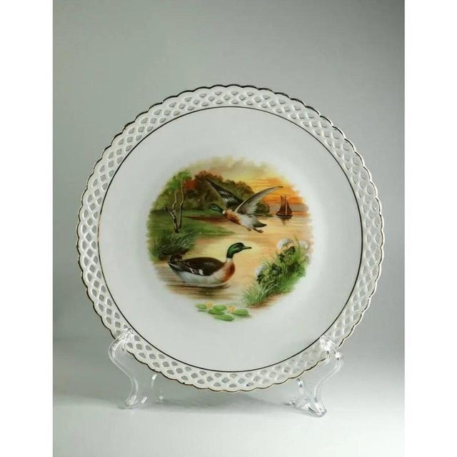 Set 9 Plates, Bavaria Schumann, Porcelain, Reticulated design Gold Rim The plates is beautifully decorated with a...