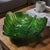 This Vintage Forest Green Glass Leaf Shaped Footed Candy Dish is a charming and unique piece for serving and displaying...