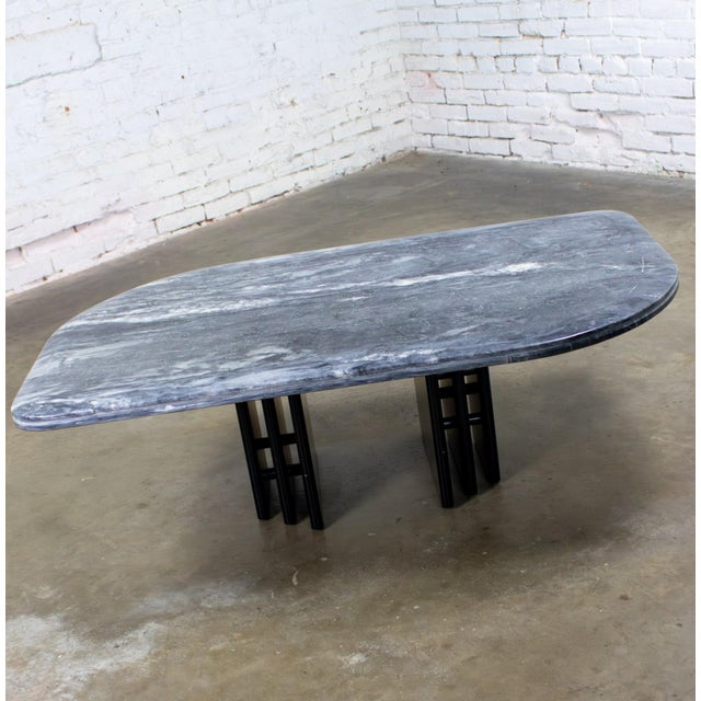 Fabulous Late 20th Century Scandinavian Post Modern to Postmodern coffee table comprised of a cat eye shaped gray & black...
