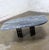 Fabulous Late 20th Century Scandinavian Post Modern to Postmodern coffee table comprised of a cat eye shaped gray & black...