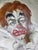 An expressive oil painting on canvas depicting a clown's melancholy face, characterized by bold brushstrokes and a highly...
