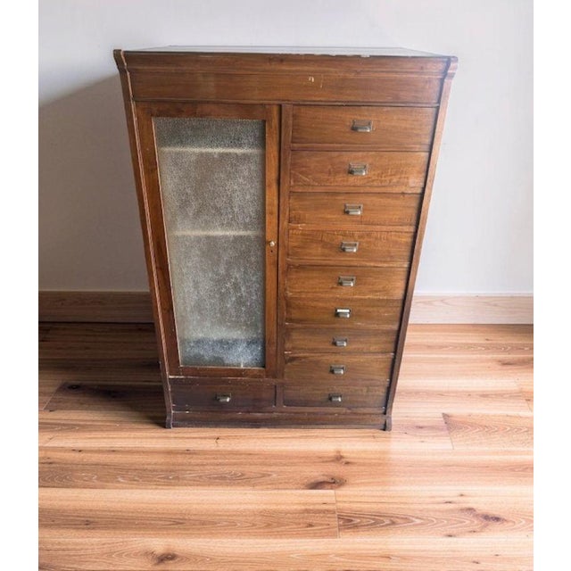 Walnut display cabinet, wardrobe, and chest of drawers, from the early 1900s. The wardrobe is divided into two sections:...
