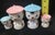 This adorable breakfast set includes: 2 egg cups / 1 boy & 1 girl with tops (hats) Pair matching of Salt & Pepper shakers...