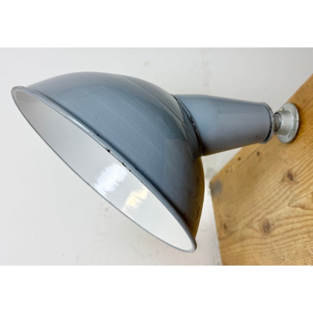 Industrial grey enamel factory wall light made in United Kingdom during the 1960s. White enamel inside the shade. Iron...