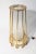 Set of two floor lights from Venini featuring tubular glass rods inserted into brass structure. This piece is attributed...