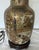 Large beautifully painted Satsuma Style lamp with cream crackle glaze and gold accents. One side depicts women in a...