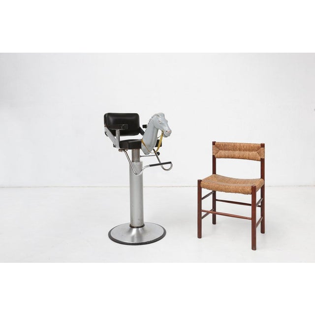 A delightful and imaginative children’s barber chair from Belgium, dating to the 1950s, designed to transform an ordinary...