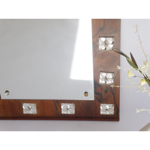 A vintage Swedish full length wooden wall mirror made out of teak with a beautiful frame with acrylic shapes all around....
