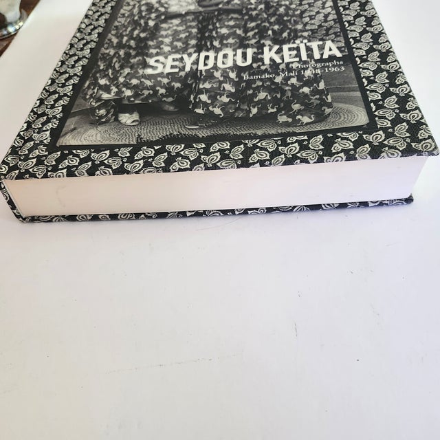 This is a first edition book made by Steidl. Seydou Keïta was born in Bamako, Mali in 1921, then part of the colony of...
