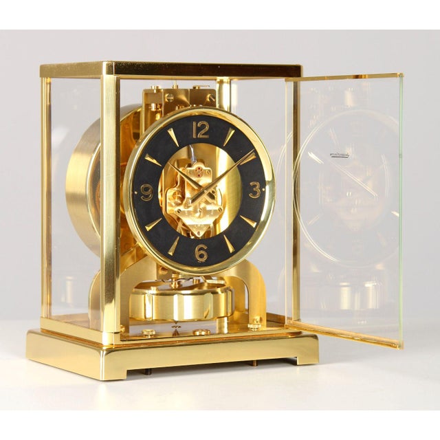 Atmos clock by jaeger lecoultre with black dial switzerland brass year of manufacture 1965 dimensions: h x w x d: 22 x 18...