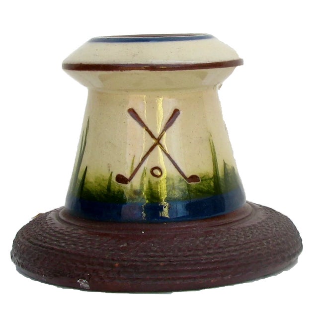 This charming match strike / vesta is lovely example of English Torquay red earthenware pottery. Decorated in an early...