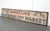 Reclaimed hand painted movie set street sign made of aluminum with a wooden back. The signs read "Samstein's Meat &...