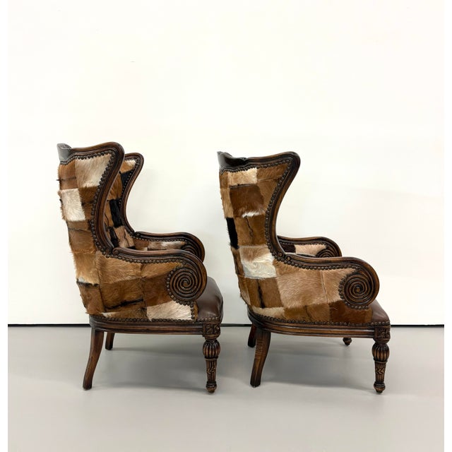 Vintage Carved Wood Patchwork Cowhide Wingback Chairs - Pair For Sale In West Palm - Image 6 of 9