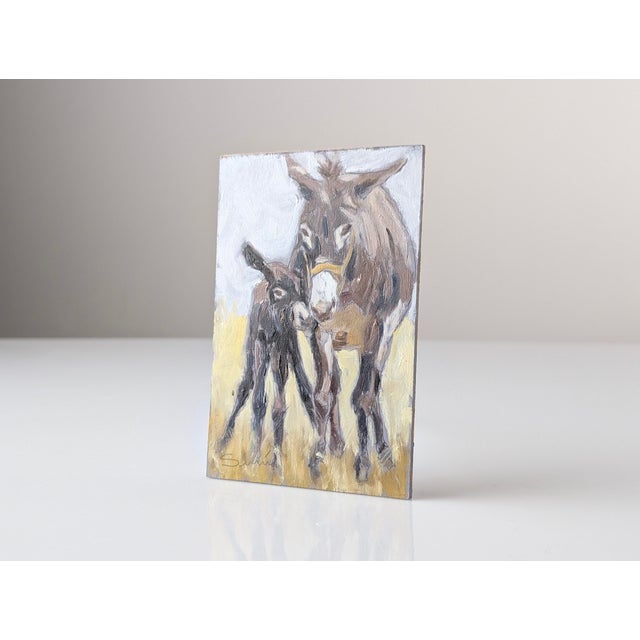 Oil painting on panel depicting a donkey and foal in a rural setting. The composition employs expressive, textured...