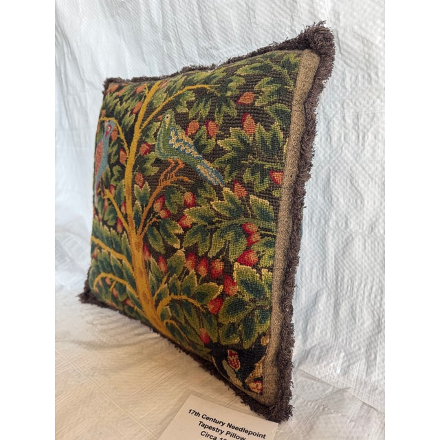 This rare 17th century needlepoint tapestry pillow dates to circa 1600 and features a richly detailed figural and...