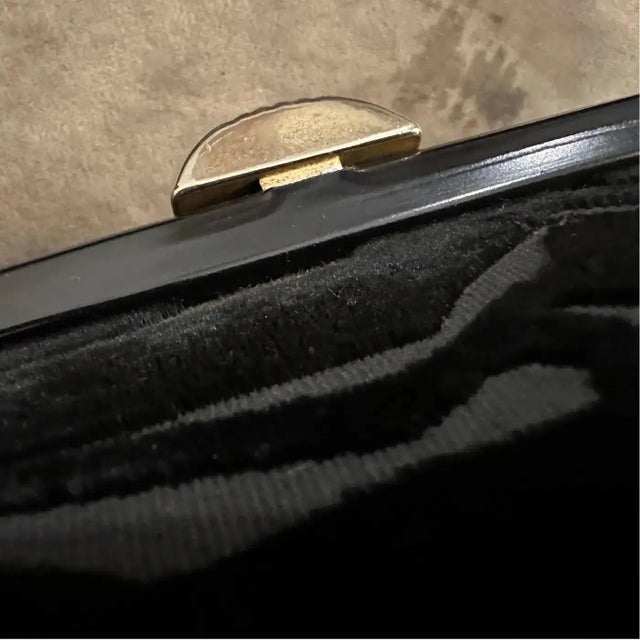 This is a beautiful, highly stylized vintage top-handle bag, likely dating to the 1950s or early 1960s. The exterior...