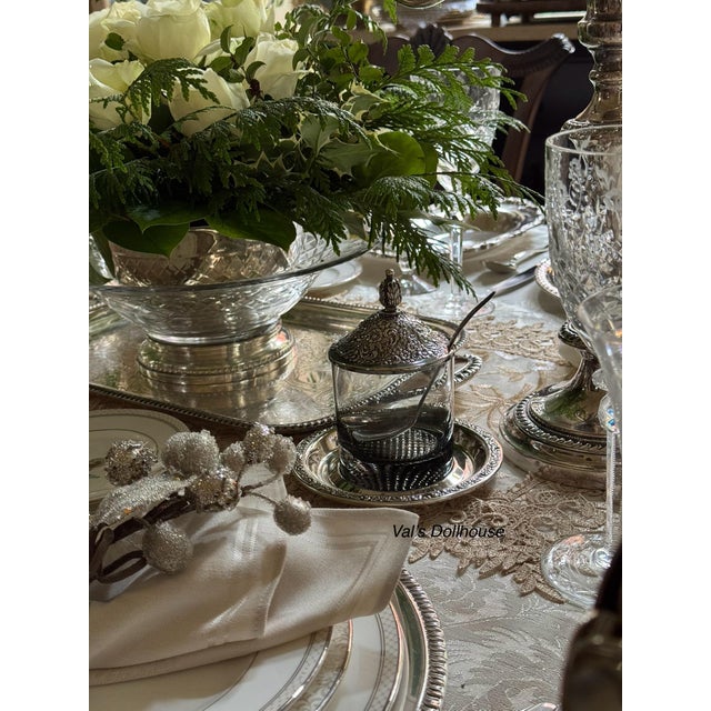 Here is an impressive serving or display piece crystal bowl with a sterling silver base. The bowl features a criss-cross...