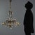 Copper-plated metal and glass chandelier. Six lights supported by curved arms, leafy sheet metal decorations, clear glass...