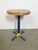 Vintage industrial stool. It features a blue iron leg and a solid wooden seat. The diameter of the seat is 35 cm. The...
