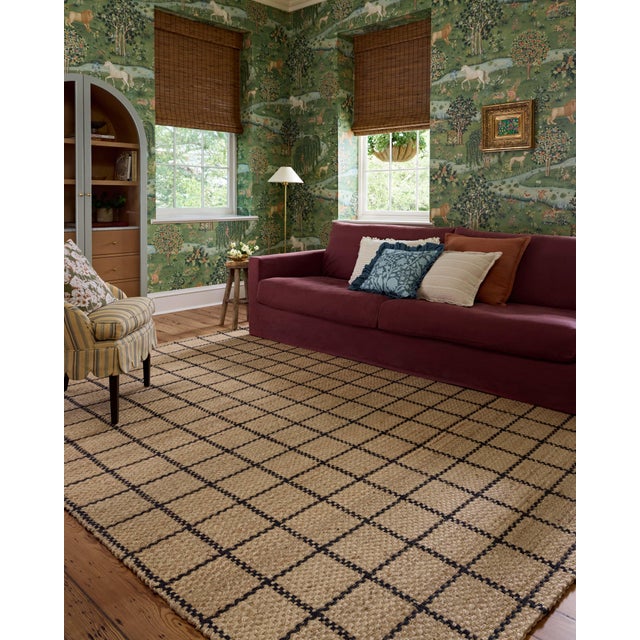 The Fletcher Collection from Chris Loves Julia x Loloi is a handwoven jute rug with a large-scale grid pattern for an...