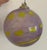 Stunning transparent hand blown lilac art glass ornament with lemon yellow accents and swirls. This intricate piece...