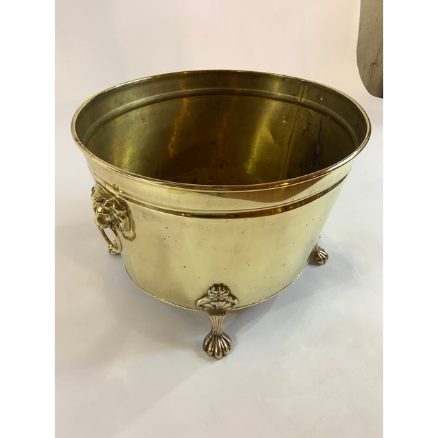 Beautiful, large oval-form footed vintage brass planter with lions head handles. Classic English style. Can be used as a...