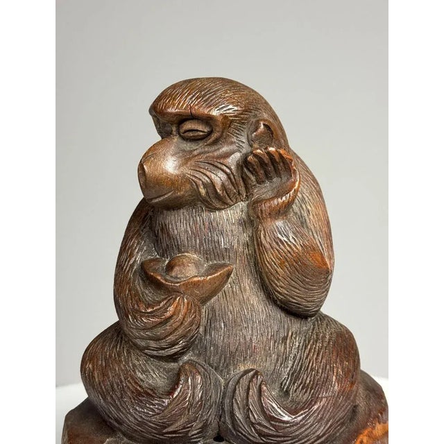 Hand-carved monkey statue. 20th century. In very good condition. Dimensions: 25H x 16W x 16D
