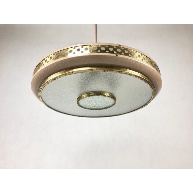 Ceiling lamp manufactured by L'udib from Bratislava in the 1950s. The upper part and lower rim of the saucer are...