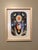 Grave Angel presents a striking figure adorned with vibrant circular patterns, juxtaposed against a muted background of...